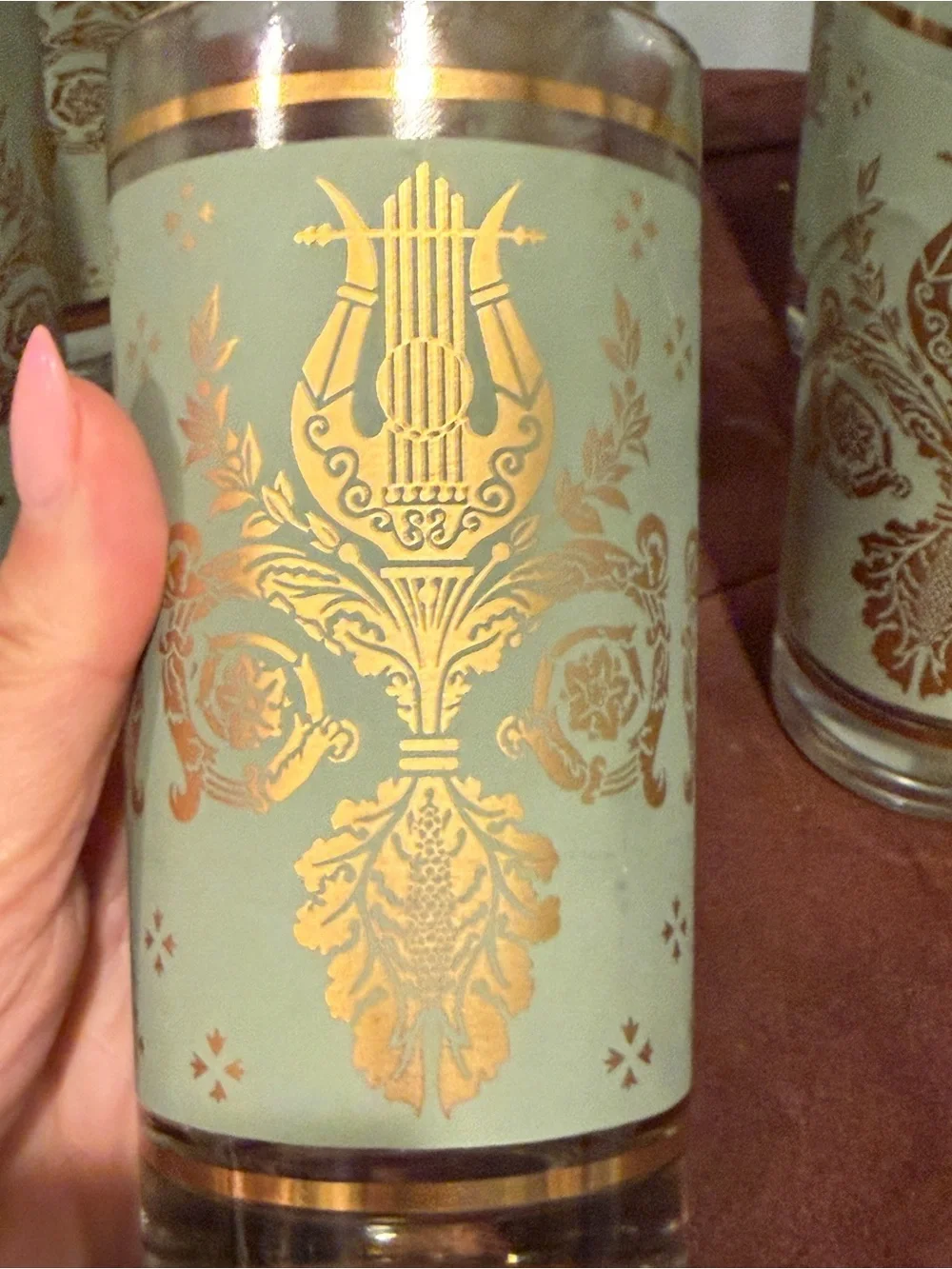 Set of 6 glasses vintage green and gold design. Holds 8 ounces